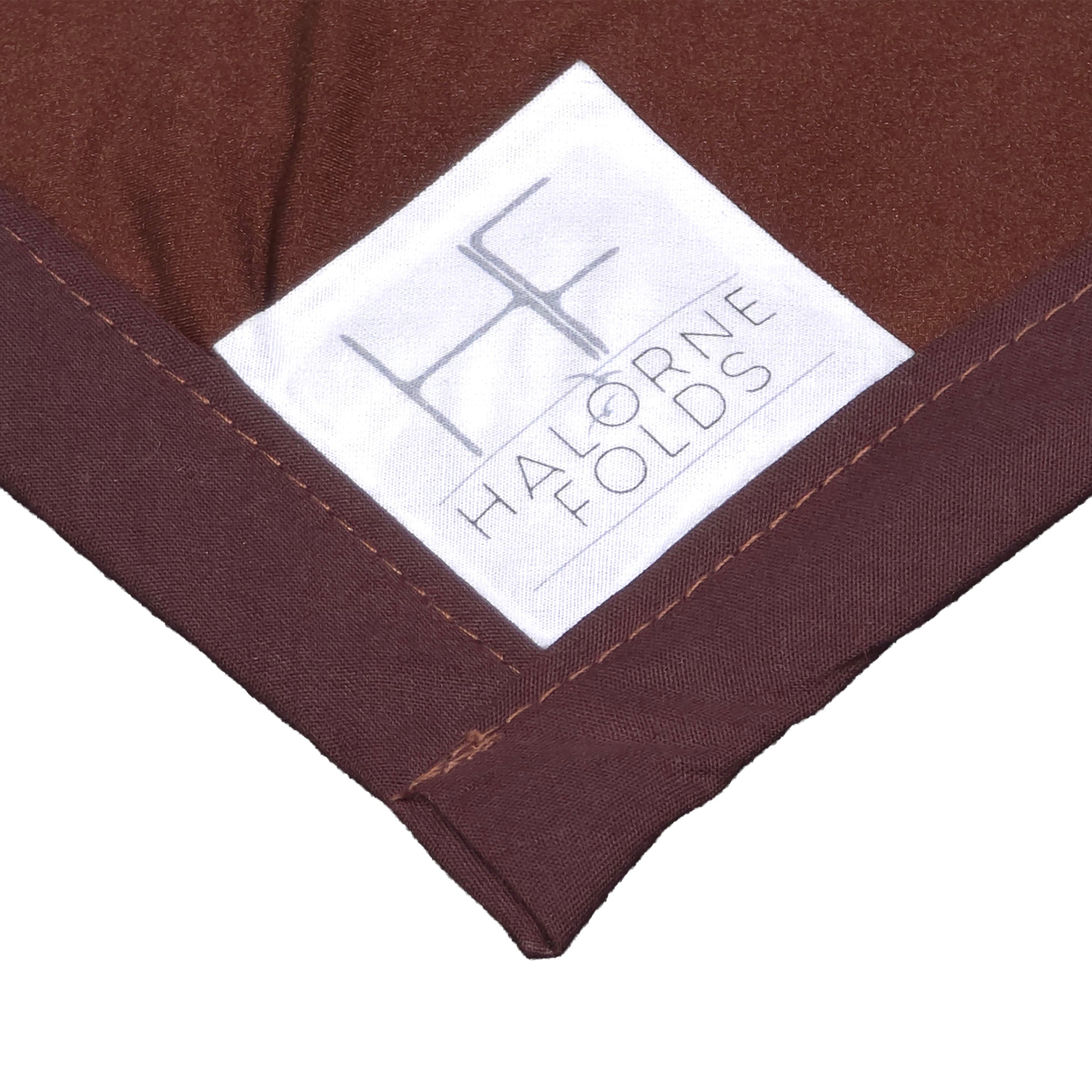 Close-up of a centrally placed back logo on a bandana by Halorne Folds. 