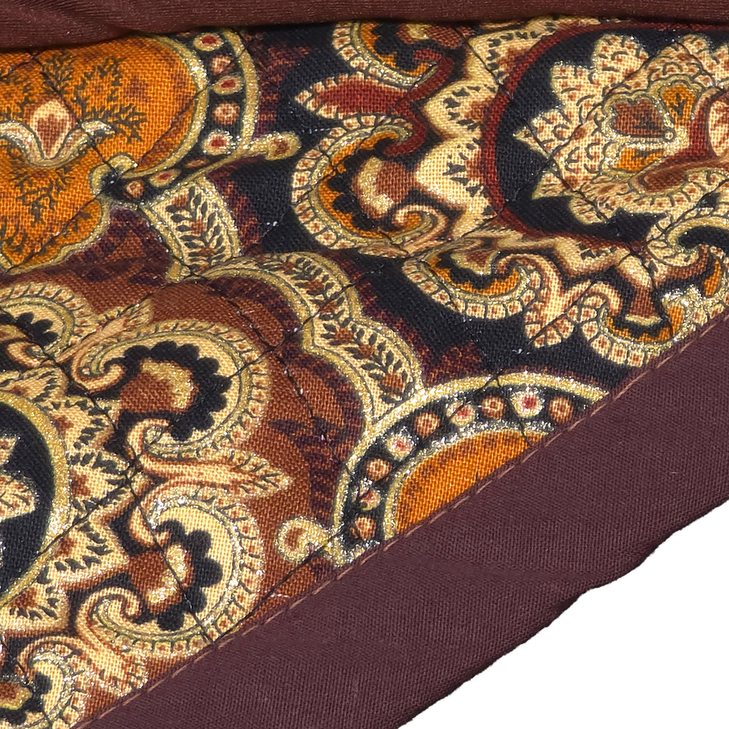 Close-up of the border and front fabric of a bandana by Halorne Folds. 